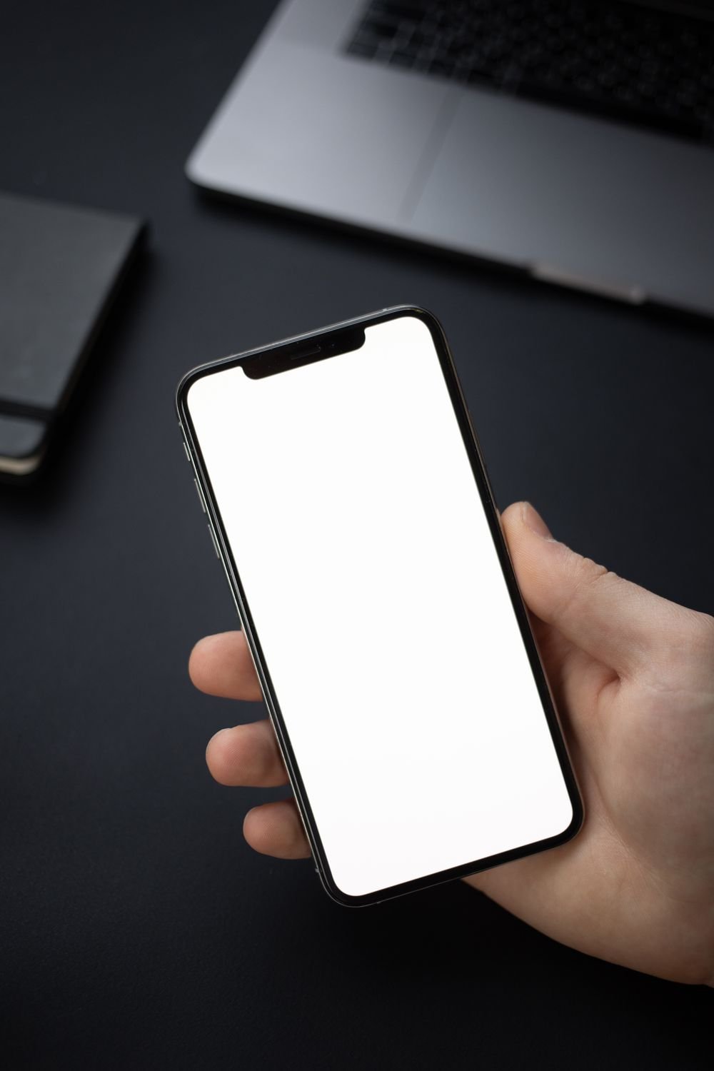 Phone screen mockup held in hand