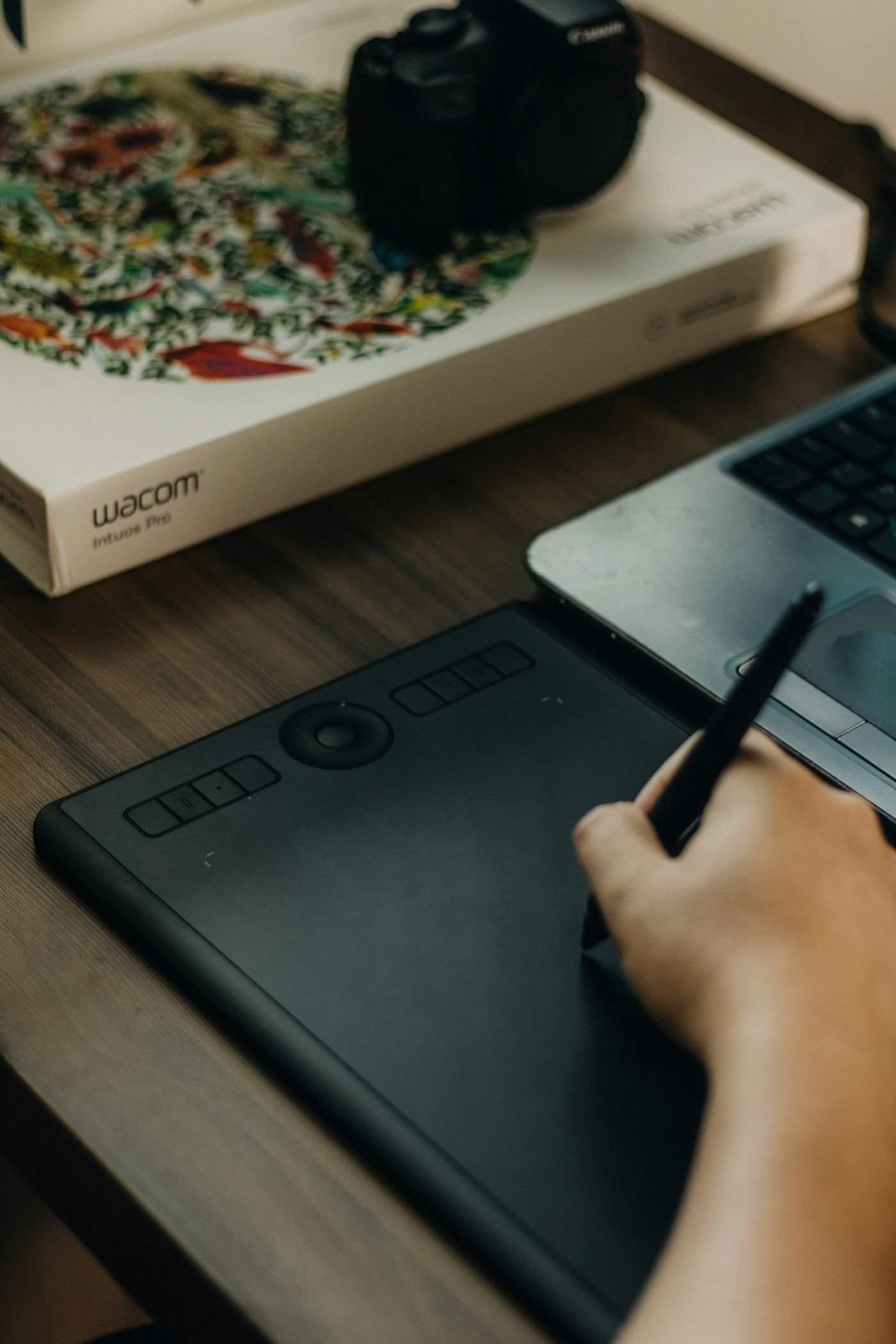 Designer editing a layout on a laptop